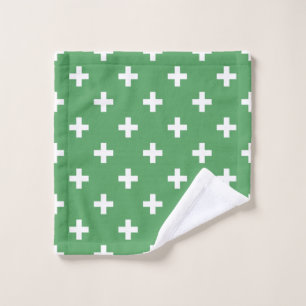 White polka crosses on green wash cloth