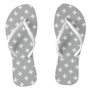White polka crosses on grey flip flops