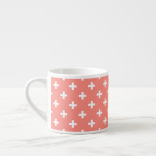 White polka crosses on peach espresso cup