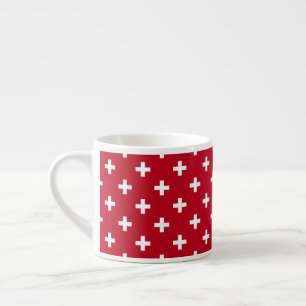 White polka crosses on red espresso cup