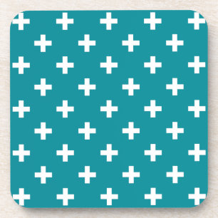 White polka crosses on teal coaster