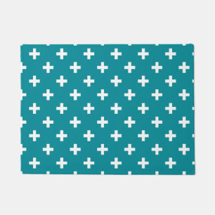 White polka crosses on teal doormat
