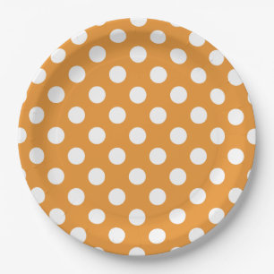 White polka dots on amber paper plate