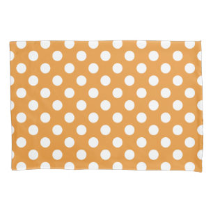 White polka dots on amber pillowcase