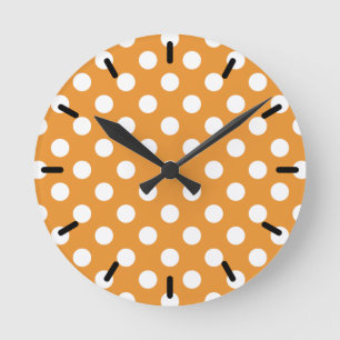 White polka dots on amber round clock