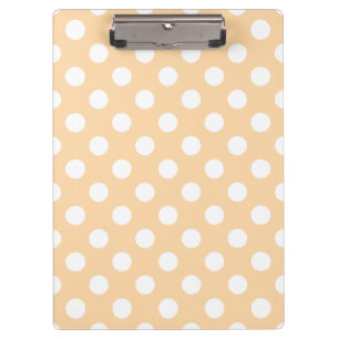White polka dots on beige clipboard