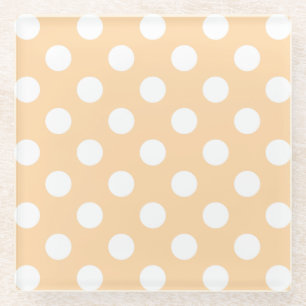 White polka dots on beige glass coaster