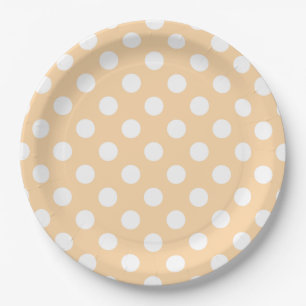 White polka dots on beige paper plate