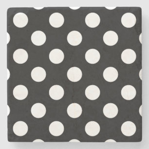 White polka dots on black stone coaster