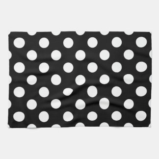 White polka dots on black tea towel