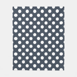 White polka dots on blue-gray fleece blanket