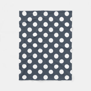 White polka dots on blue-gray fleece blanket