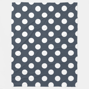 White polka dots on blue-gray fleece blanket