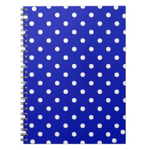 white polka dots on blue notebook