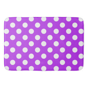 White polka dots on bright purple bath mat
