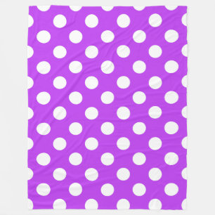 White polka dots on bright purple fleece blanket