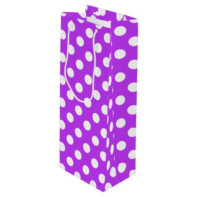 White polka dots on bright purple wine gift bag (Front Angled)