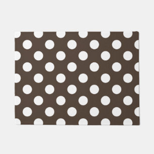White polka dots on brown doormat