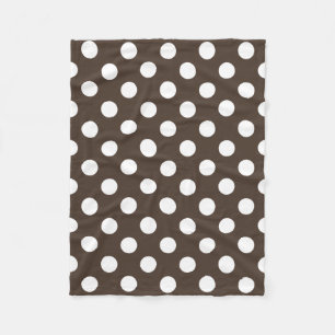 White polka dots on brown fleece blanket