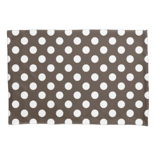 White polka dots on brown pillowcase