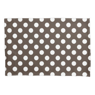 White polka dots on brown pillowcase