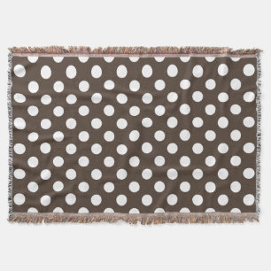 White polka dots on brown throw blanket