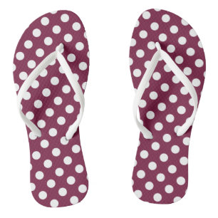 White polka dots on burgundy flip flops
