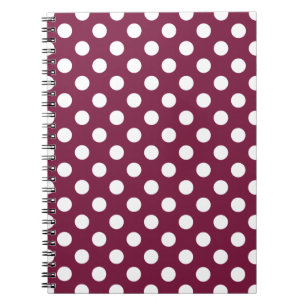 White polka dots on burgundy notebook