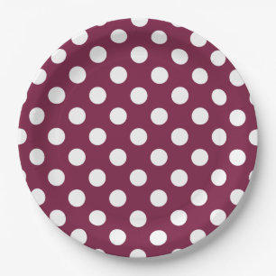 White polka dots on burgundy paper plate