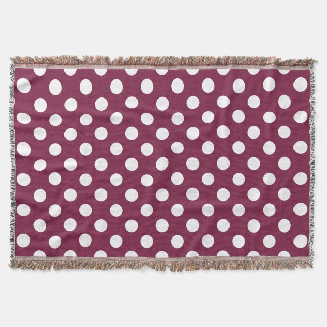 White polka dots on burgundy throw blanket (Front)