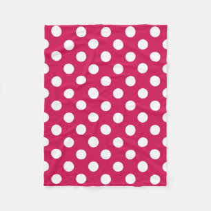 White polka dots on cerise fleece blanket