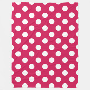 White polka dots on cerise fleece blanket