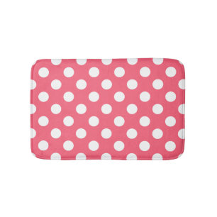 White polka dots on coral bath mat