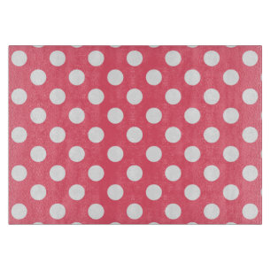 White polka dots on coral cutting board