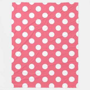 White polka dots on coral fleece blanket