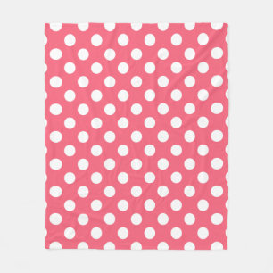 White polka dots on coral fleece blanket