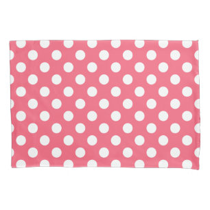 White polka dots on coral pillowcase