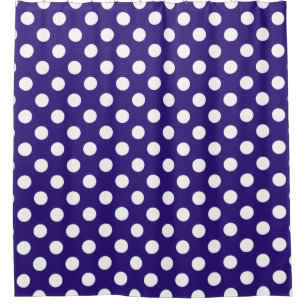 White polka dots on dark blue shower curtain