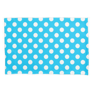 White polka dots on electric blue pillowcase