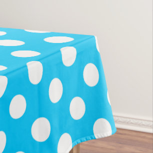White polka dots on electric blue tablecloth
