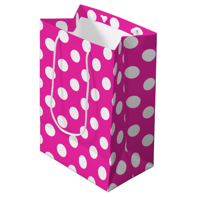 White polka dots on fuchsia medium gift bag (Front Angled)
