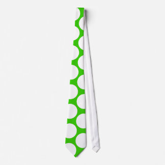 White polka dots on green tie