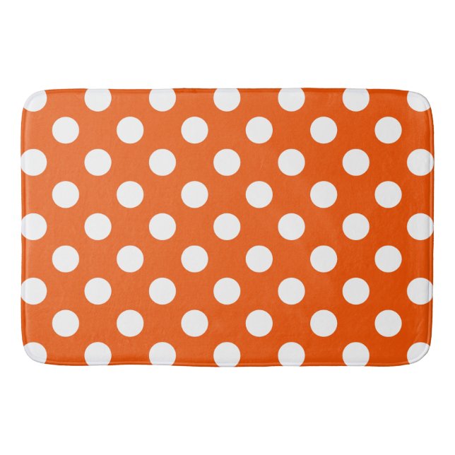 White polka dots on orange bath mat (Front)