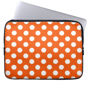 White polka dots on orange laptop sleeve