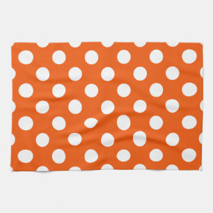 White polka dots on orange tea towel