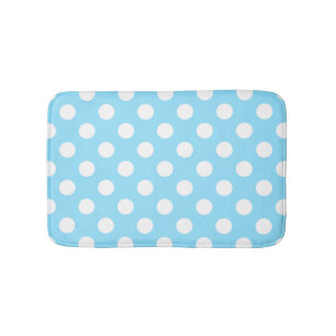 White polka dots on pale blue bath mat