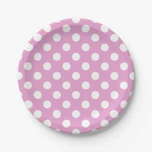 White polka dots on pale pink paper plate