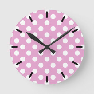 White polka dots on pale pink round clock