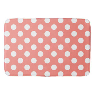 White polka dots on peach bath mat