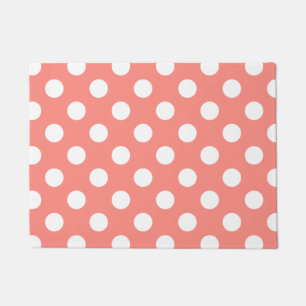 White polka dots on peach doormat